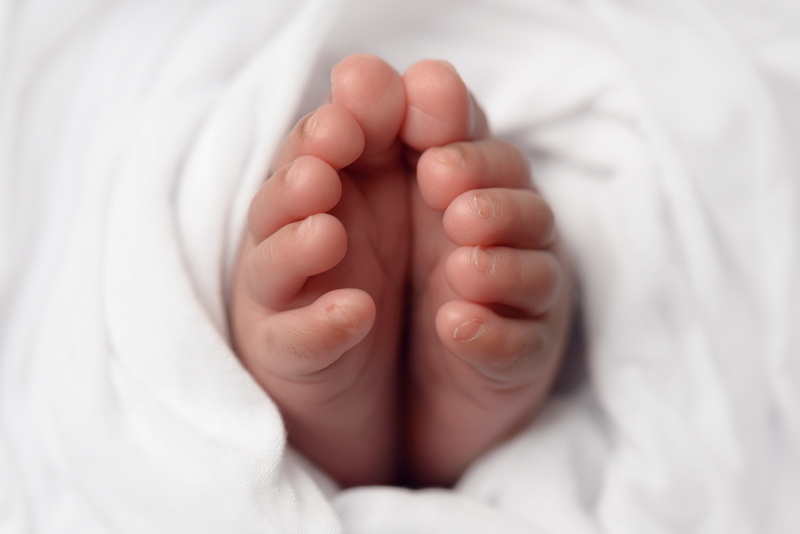 one person, feet, blanket, centered, cute, 5K, linen, bed, low section, child, human body part, cozy, baby, little, focus, babies, selective, white background