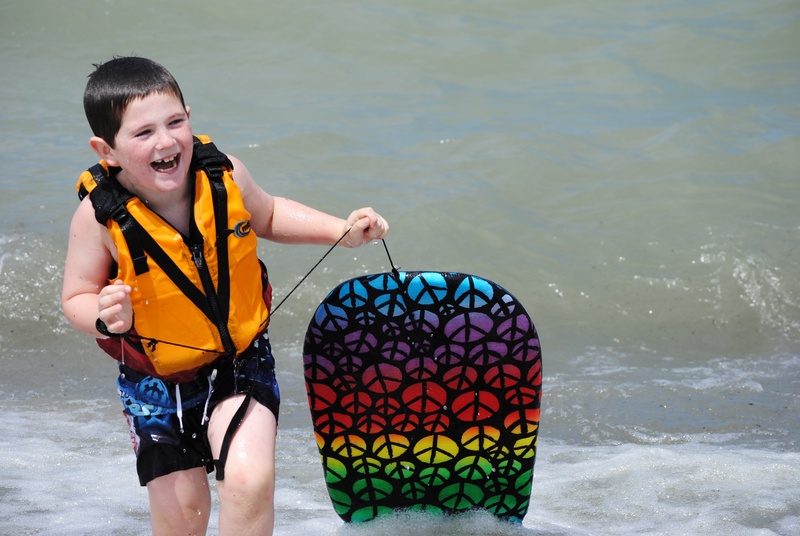 standing, one Person, people, board, wearing, lifestyles, multicolored, portrait, vest, water, summer, sea, real people, leisure activity, nature, happiness