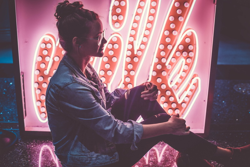 knees, 5K, adult, portrait, leisure activity, neonsign, woman, sign, leather, fashion, three quarter length, real people, sitting, light, glasses, knee