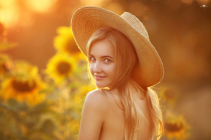 Dmitry Arhar, women outdoors, smiling, model, sunflowers, blonde, straw hat, women, women with hats, depth of field, 1080P, looking at viewer, portrait
