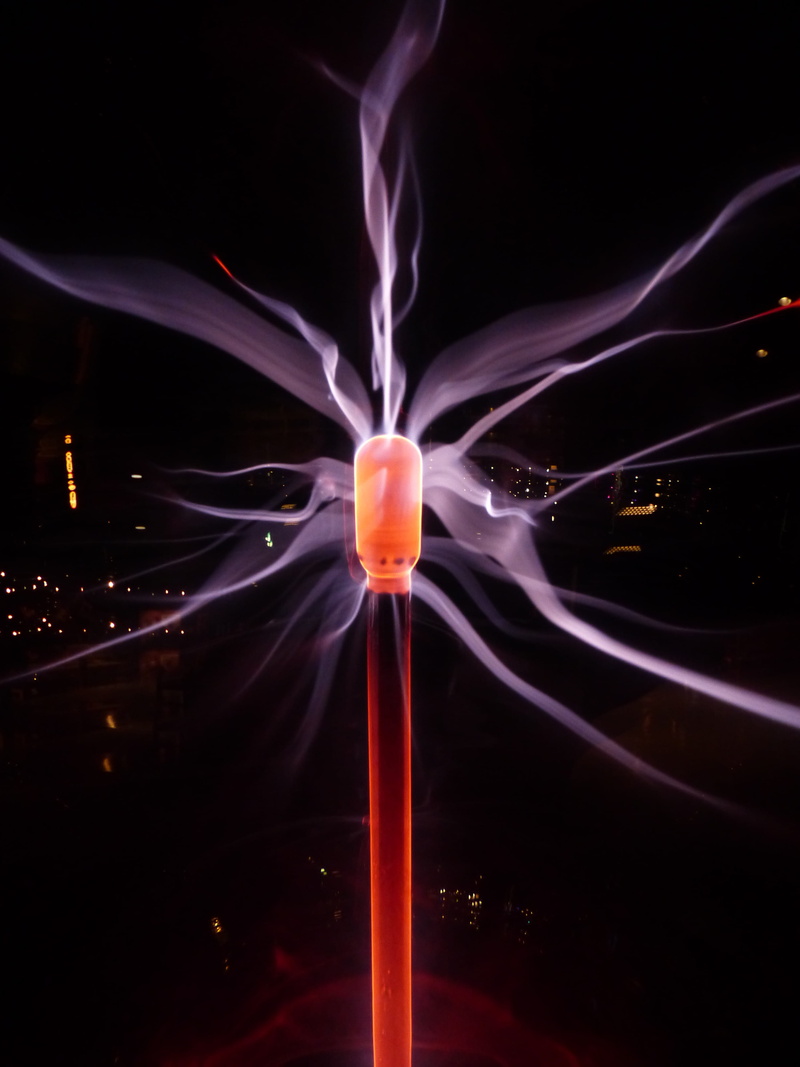 light trail, indoors, physical toy, electricity, lighting equipment, plasma globe, orange, studio shot, pattern, violet, long exposure, Discharge, glowing