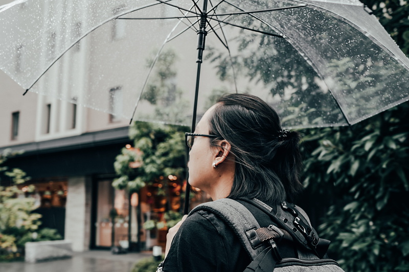 looking, focus on foreground, hair, man, casual clothing, guy, travel, leisure activity, wearing, women, architecture, rain, accessory, wet, clothing, raining