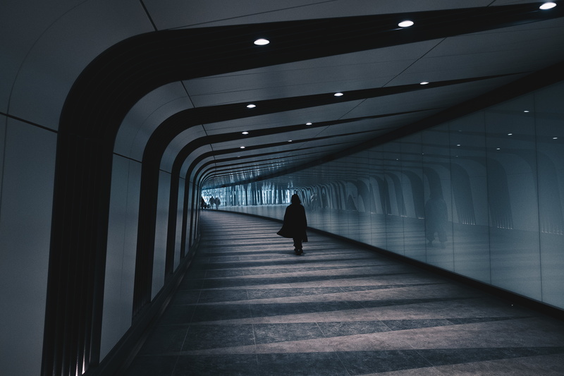 underground passage, footpath, silhouette, futuristic, people, arcade, black, ceiling, business, cloak, walking, diminishing perspective, urban Scene, tunnel