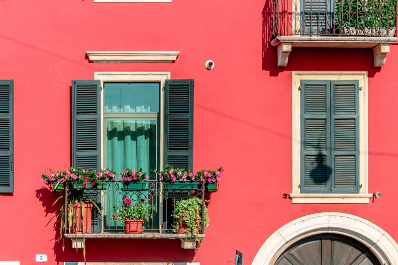 built structure, flower pot, window shade, window, pottery, flower, no people, house, pink color, day, nature, city, vase, plant, shutter, home decor, pink