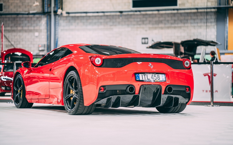 land vehicle, car, motor vehicle, red, racecar, wheel, mode of transportation, transportation, architecture, outdoors, built structure, city, toy, day