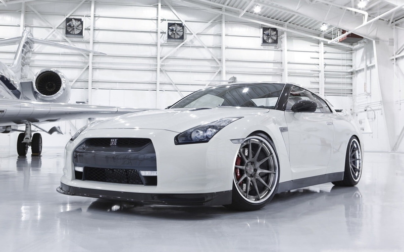 Nissan GTR, nissan, vehicle, land vehicle, day, car, wealth, industry, r, shiny, modern, people, silver colored, white cars, inside, white, transportation