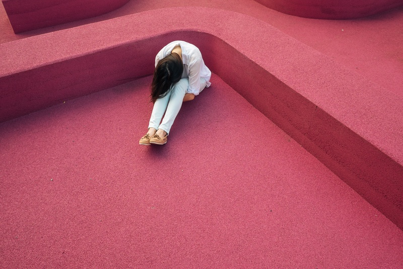 high angle view, adult, full length, sitting, girl, women, depression - sadness, outdoors, hairstyle, people, real people, indoors, private, pink color