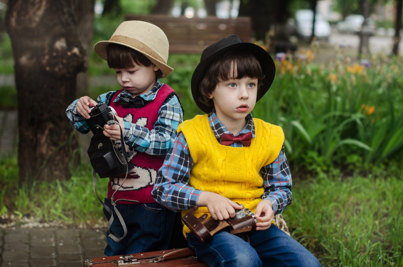 people, facial expression, outdoors, grass, fashion, 4K, togetherness, sitting, little, females, front view, kids, sister, women, men, bonding, children