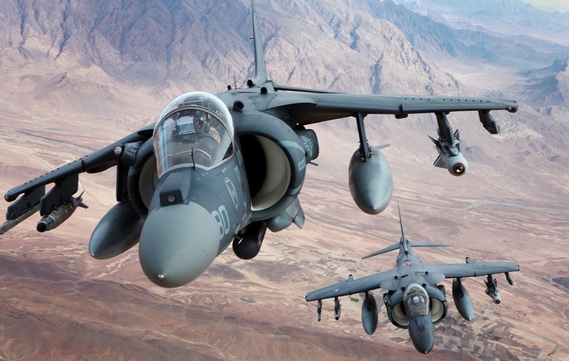 mid-air, single object, 720P, army, no people, air force, aggression, day, mountain, military, airplane, fighter plane, transportation, propeller, mode of transportation