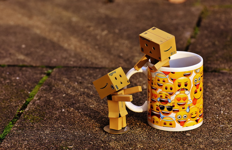 day, human representation, cute, mug, robot, nature, high angle view, representation, technology, made, land, for two, send, focus on foreground, yellow