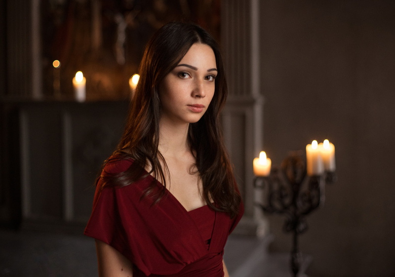 makeup, freckles, wavy hair, looking at viewer, red clothing, brunette, candles, dress, eyeliner, long hair, women, depth of field, 1080P, Maxim Maximov