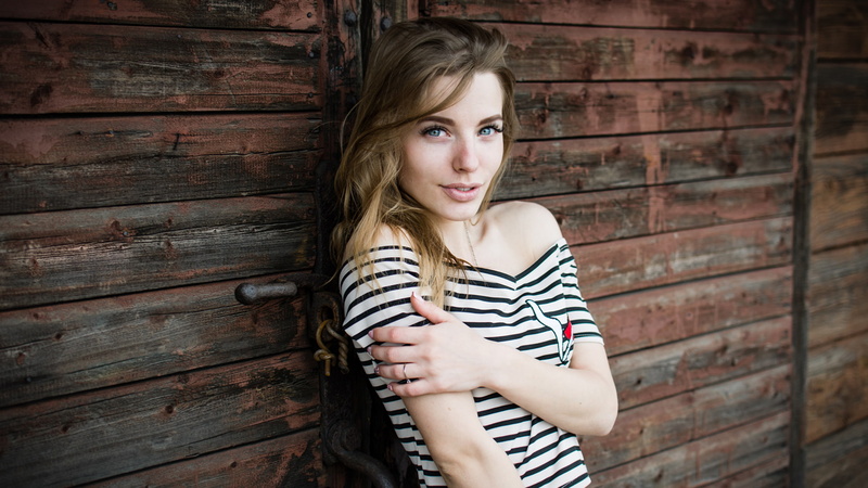 striped, looking at camera, hairstyle, women, wood - material, portrait, teenager, smiling, standing, blonde, contemplation, adult, blond hair, casual clothing