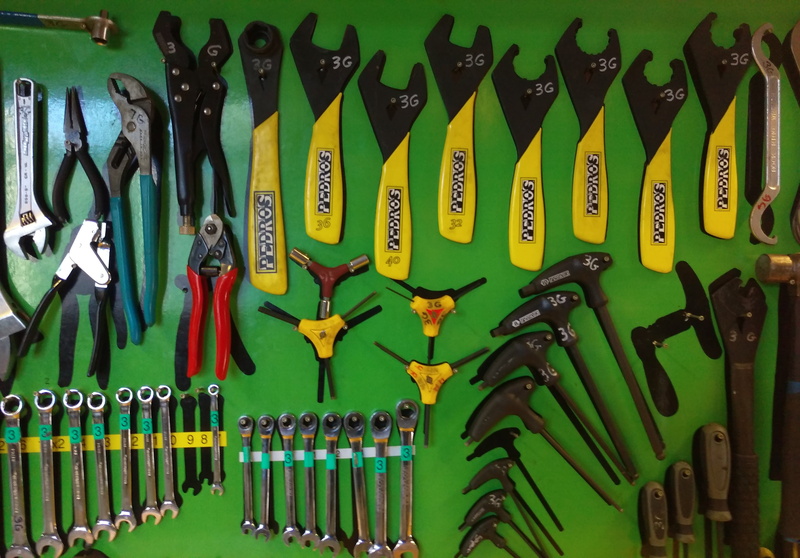 still life, green color, cycle, container, maintenance, choice, repair, variation, cycling, no people, bottle, tools, bicycle, bike, garage, fix, indoors