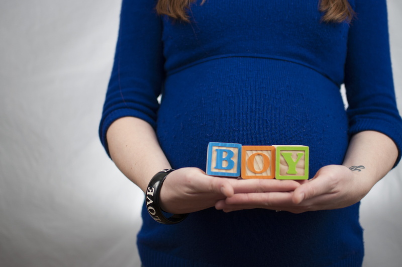indoors, pregnancy, studio shot, midsection, block, close-up, communication, alphabet blocks, front view, women, boy, human body part, tummy, casual clothing