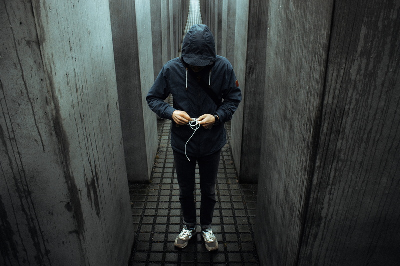 jacket, leisure activity, crime, wall - building feature, pullover, dark, hoodie, person, people, one Person, outdoors, man, only men, holding, loneliness