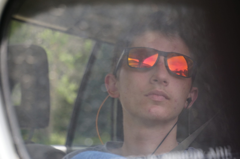 reflection, red river, person, young adult, day, headshot, fashion, one person, introspective, boy, focus on foreground, front view, tall pine resort, man