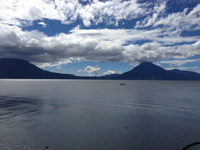 land, sea, sky, lake, mountain peak, nature, lago atitlan, no people, mountain range, day, water, scenics - nature, beauty in nature, waterfront, non-urban scene