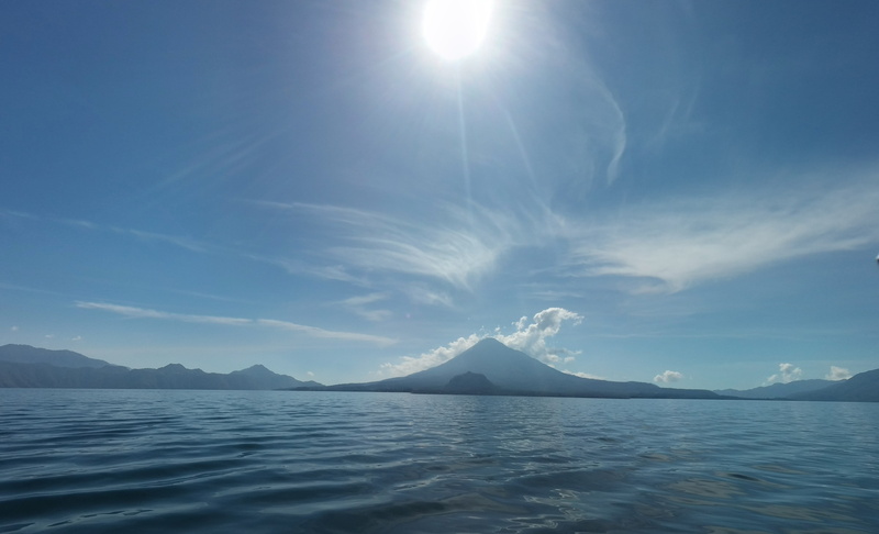 lake, snowcapped mountain, lens flare, atitlan, sololá, outdoors, waterfront, mountain, 5K, sky, day, sun flare, brightly lit, cold temperature, no people