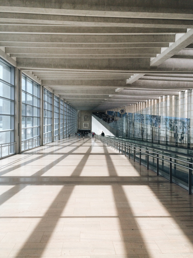 transportation, one person, sun, 2K, empty, symmetry, ben gurion, window, real people, architectural column, bridge, open, airport, sunlight, shadow, tiled floor