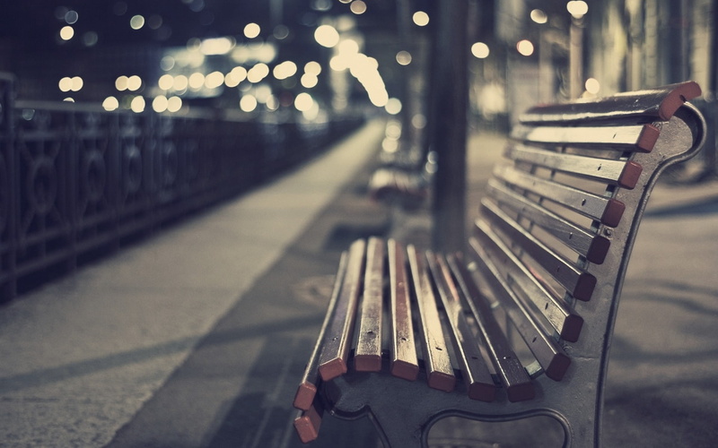 selective focus, architecture, night, close-up, illuminated, filter, park bench, brown, outdoors, focus on foreground, footpath, metal, city, empty, bench