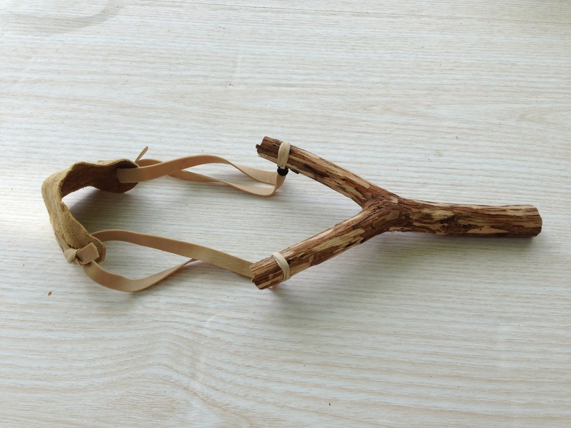 mischief, wood - material, art and craft, weapon, tree trunk, high angle view, creativity, wood, elastic, indoors, 2K, love, slingshot, brown, positive emotion