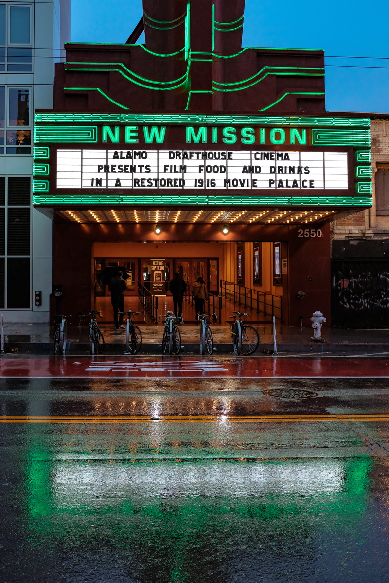 illuminated, vintage, non-western script, bicycle, theater, movie palace, theatre, cafeteria, city, cinema, transportation, real people, building exterior