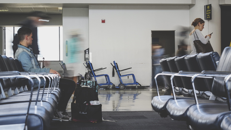 real people, transportation, waiting, business, indoors, people Traveling, standing, built Structure, 5K, carrying, business Travel, casual clothing, image Technique