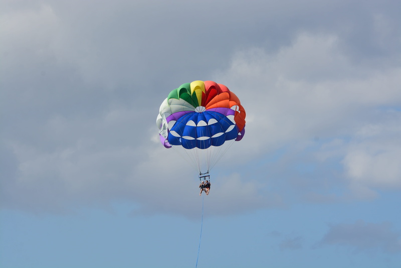 hobbies, outdoors, action, beach, flying, wind, speed, water, happiness, joy, risk, excitement, single object, cloud - sky, exhilaration, mid-Air, lifestyle