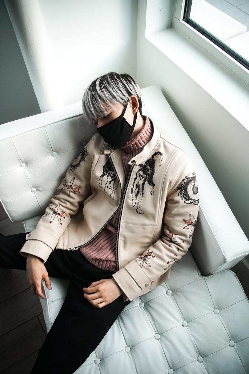 sofa, leather jacket, standing, lounge, boy, person, widow light, man, fashion, turtleneck, front view, 8K, adult, indoor, leather, lying, tufted, mask