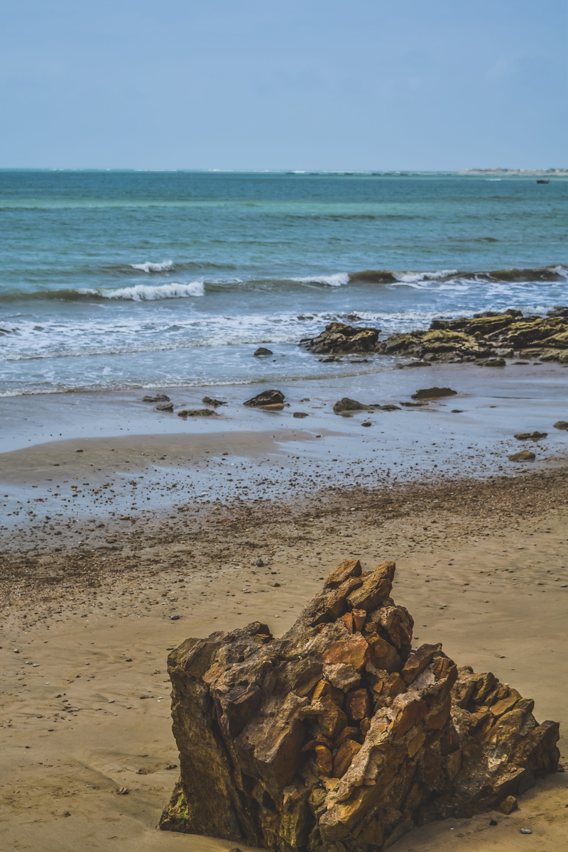oceanview, beauty in nature, blue, outdoors, pakistan, rock - object, motion, solid, waves, tranquility, ocean, sand, beach, water, horizon, land, nature
