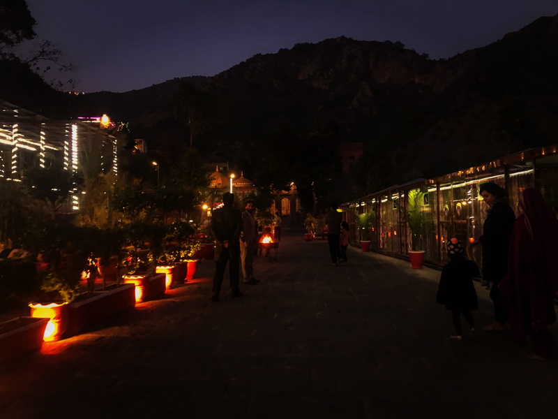 pakistan, building exterior, group of people, 4K, outdoors, night, illuminated, karachi, people, street light, incidental people, lighting equipment, tree