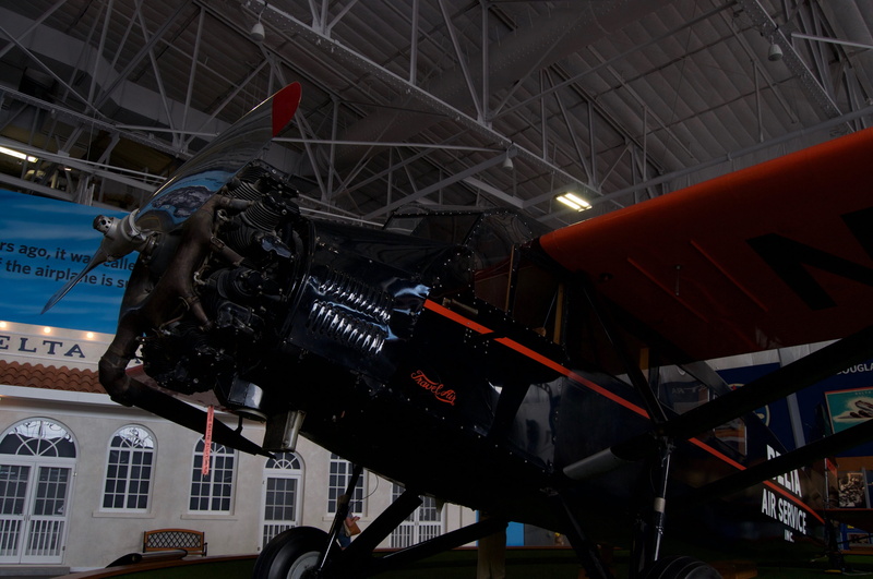 helicopter, airplane, metal, handrail, vehicle, airport, no people, ceiling, warplane, building exterior, wheel, bunker, machine, biplane, mode of transportation