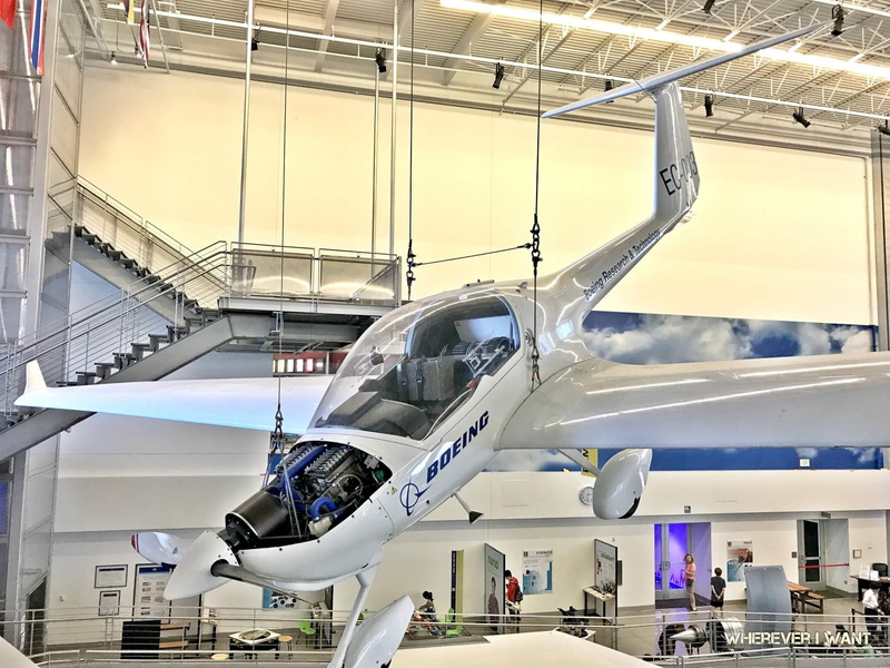 plane, airliner, travel, engineering, airplane hangar, mode of transportation, group of people, vehicle, industry, indoors, aircraft, architecture, adult