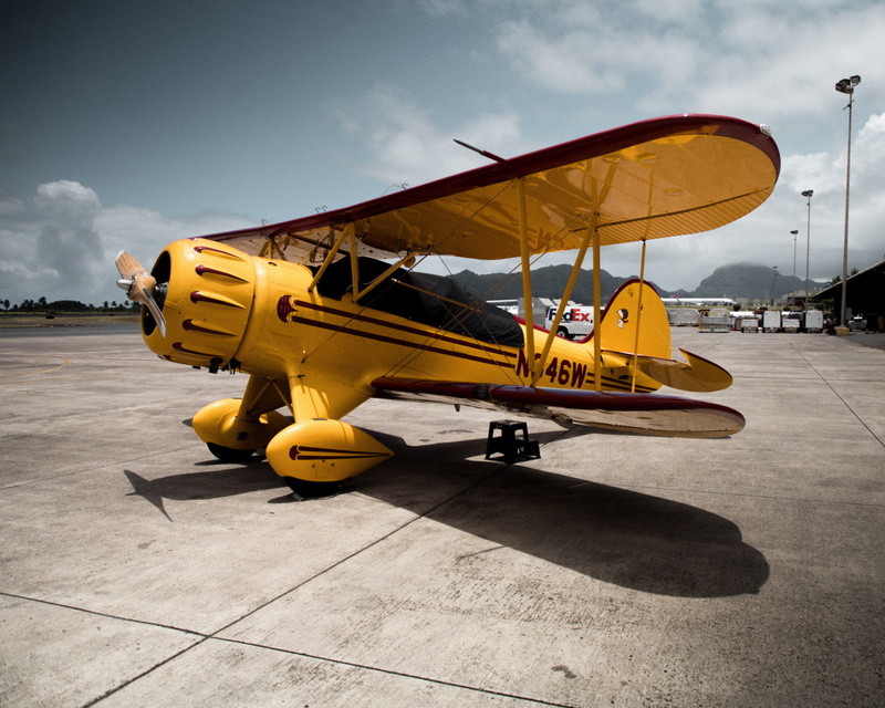 outdoors, person, urban, machine, land vehicle, transportation, town, architecture, road, airplane, flight, vehicle, one person, cloud - sky, building