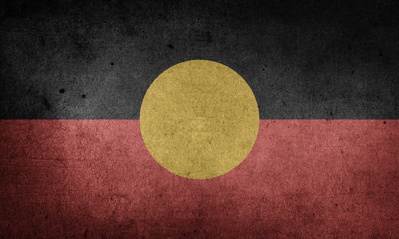 outdoors, circle, black color, textured, 1080P, high angle view, red, court, close-up, australian aboriginal flag, concrete, shadow, textured effect, yellow