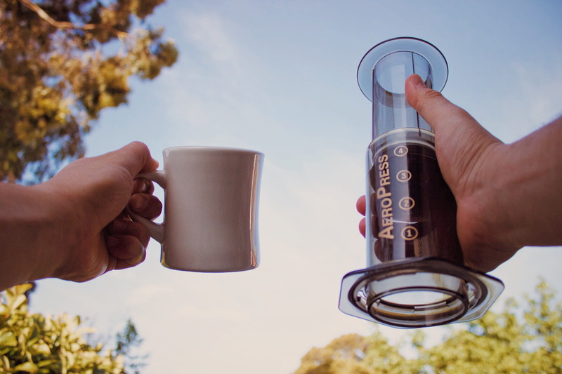 two people, plant, outdoors, holding, mug, food and drink, day, australia, awake, sky, aeropress, human body part, tree, morning, glass, hand, cheers, cup