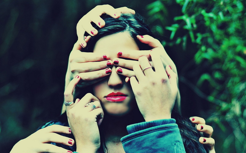 hands, covering face, outdoors, headshot, hand, day, red lipstick, real people, human body part, one person, nail polish, portrait, adult, human face, finger