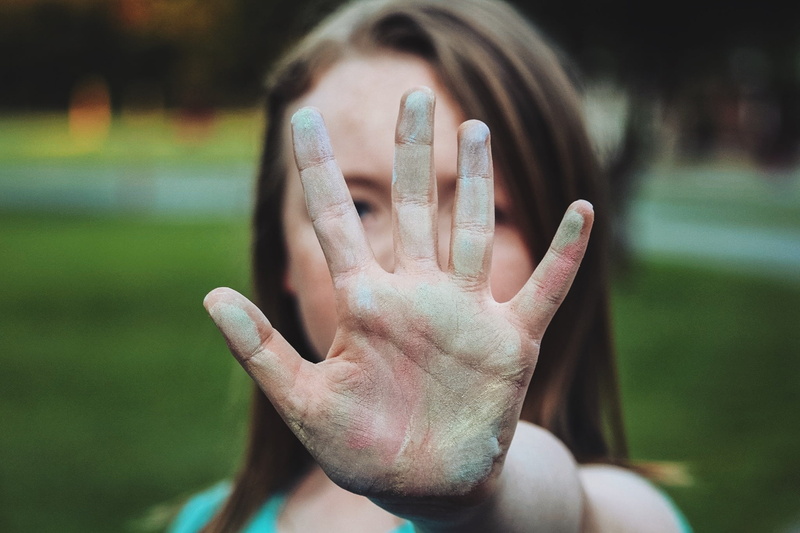 hairstyle, palm, emotion, front view, human Hand, finger, human body part, portrait, female, shy, obscured face, close-up, human face, she, hand, photo