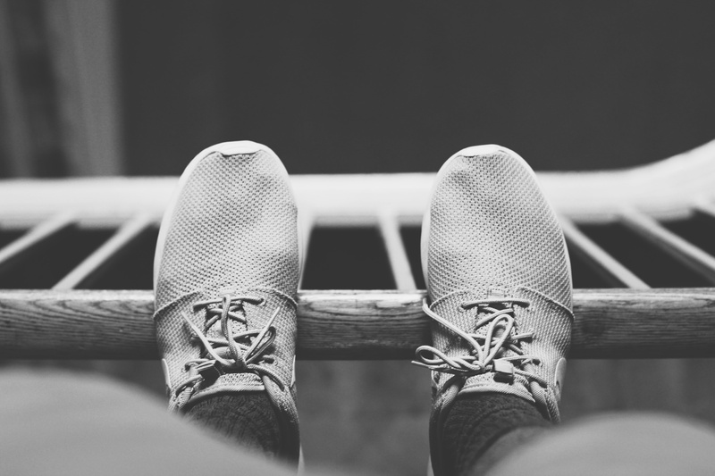 wood - material, photo, selective focus, grayscale, focus on foreground, hand, shoes, personal perspective, human limb, panel, finger, one person, s, close-up