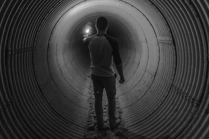 4K, leisure activity, one boy only, light, adult, tunnel, built structure, casual clothing, black and white, day, childhood, children only, lifestyles