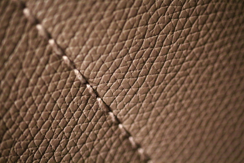 animal wildlife, close-up, no people, backgrounds, studio shot, close to, extreme close-up, indoors, 5K, sewing, orange color, ball, wrinkled, textured