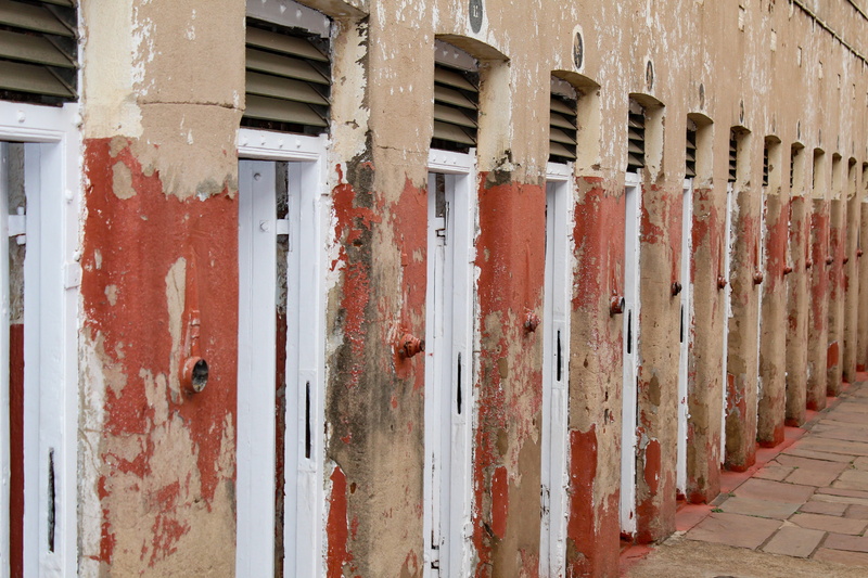 weathered, outdoors, wall - building feature, johannesburg, red, built structure, apartheid, prison cells, building, day, security, south africa, metal