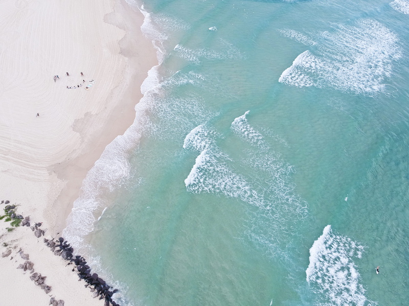 drone shot, seafoam, waterfront, high angle shot, waves, beach, day, angle, calm, h2o, outdoors, scenic, nature, tranquil scene, top view, ocean, high angle view