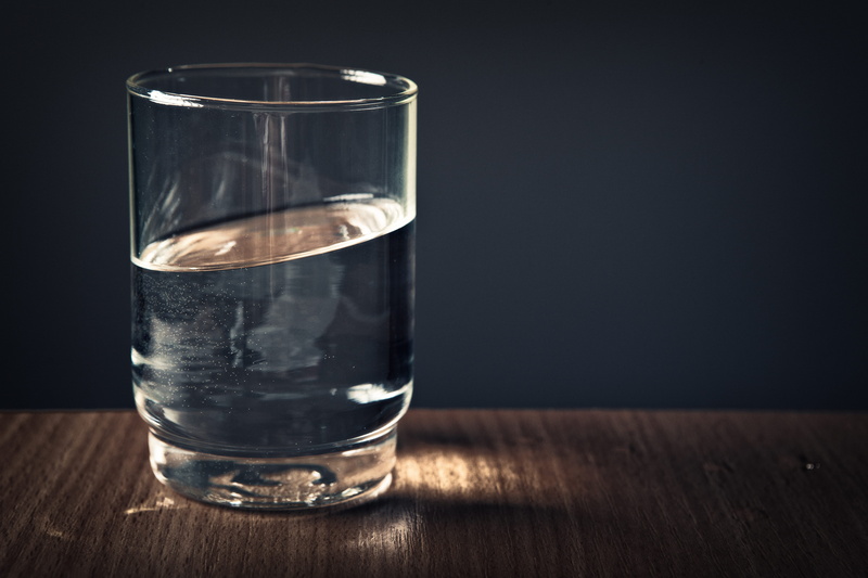 indoors, black background, drink, filled, alcohol, studio shot, no people, purity, glass - material, refreshment, copy space, household equipment, water