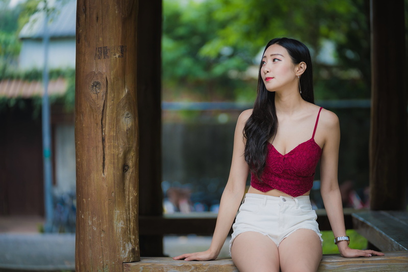 looking away, brunette, outdoors, Asian, watch, portrait, women, cleavage, model, jean shorts, thighs, long hair, frontal view, log, tank top, women outdoors