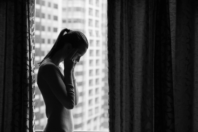 window, leisure activity, indoors, women, one person, sadness, depression - sadness, young adult, 2K, focus on foreground, hairstyle, adult, young women
