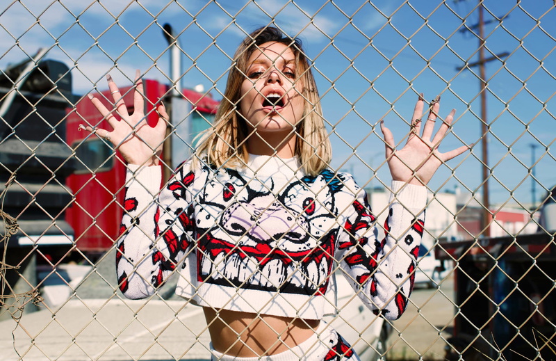 mouth, young adult, 1080P, outdoors, barrier, chainlink fence, mouth open, hairstyle, mesh, photoshoot, boundary, hair, emotion, day, looking at camera