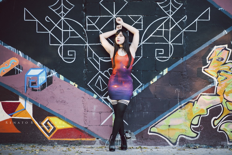 full length, one person, human representation, mural, tight dress, real people, young adult, women outdoors, model, city, art and craft, hairstyle, black hair