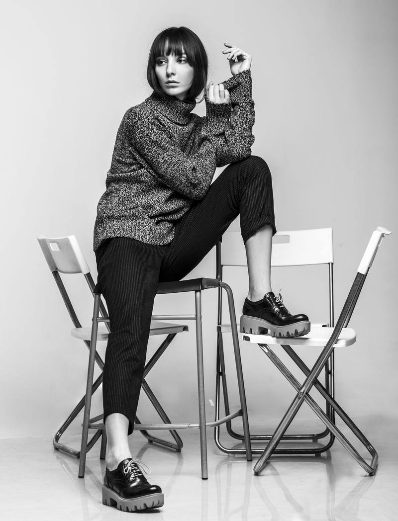 model, looking at camera, pose, insulated, casual clothing, black and white, style, female, one person, photo, bang, adult, portrait, fashion look, human
