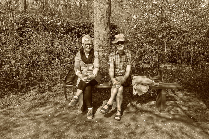 portrait, tree, 4K, crossed legs, togetherness, looking at camera, full length, people, young adult, elderly, garden, men, sitting, front view, hands around knees
